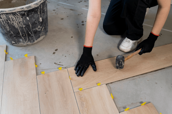 Flooring expert installing tiles on even floor